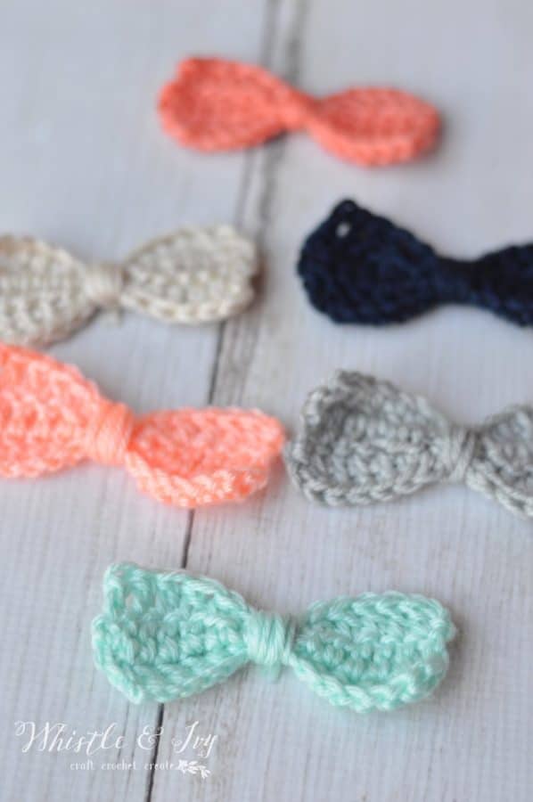 scattered crochet bows in pink, gray and mint