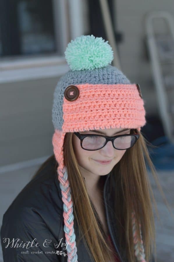 Women's Button Trapper Hat - Crochet this fun and cozy hat this winter with this free crochet pattern. 