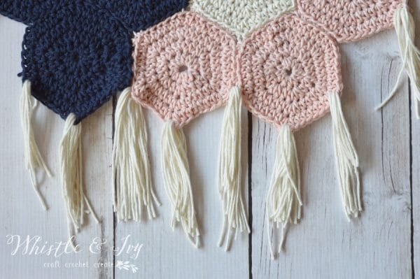 Boho Hexagon Wall Hanging - Make this beautiful wall hanging with some cotton yarn and hexagons. This wall hanging would love lovely anywhere in your home!