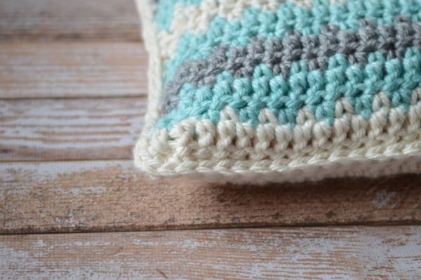 Free Crochet Pattern - Make this beautiful pillow with luscious, chunky yarn! This simple pattern works up quickly. You will love your new, soft pillow!