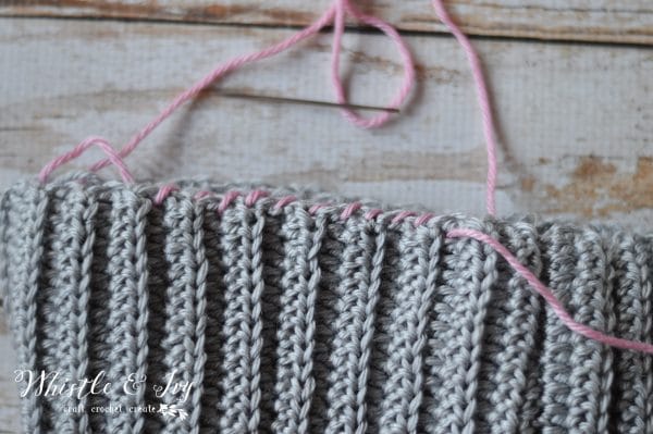 FREE Crochet Pattern - Women's Crochet Hooded Cowl | Stay cozy with this cute hooded cowl, made with the elegant grit stitch and snuggly ribbing.