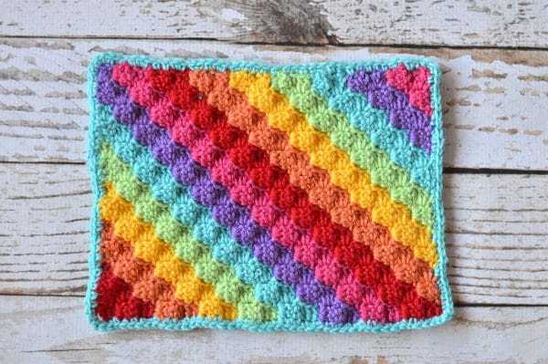 FREE Crochet Pattern: Crochet Rainbow C2c Arm Warmers | Learn how to work the fabulous C2C crochet technique and make these bright and fun arm warmers. 