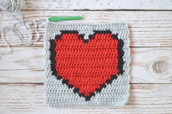 FREE Crochet Pattern: Pixel Heart Afghan Square | This fun square is perfect for your retro crochet afghan blanket, and includes both rounds and rows. 
