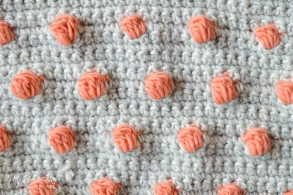 Crochet Pop Scarf - This pretty scarf comes in a fabulous kit by We Are Knitters! It's beginner friendly and cozy to wear. 