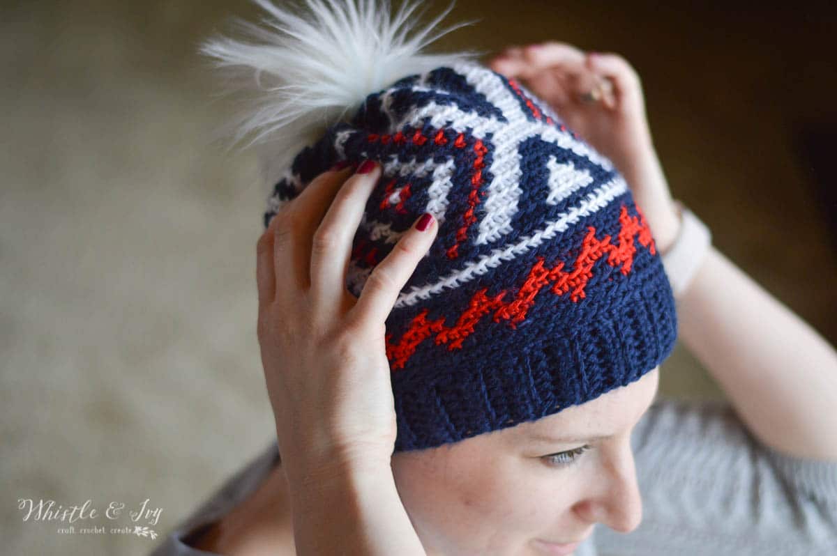 woman wearing olympic team crochet hat with red white and blue color work