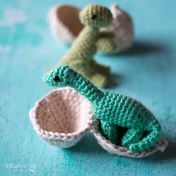 crochet hatching dinosaur apatosaurus standing in a crochet egg