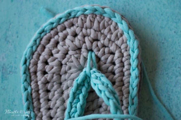 Up close view of the toe of a pair of women's crochet flip flops sandals