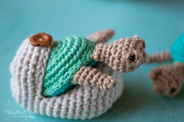 green crochet turtle hatching out of egg 