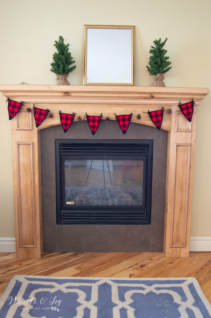fireplace with buffalo plaid garland with free crochet pattern 