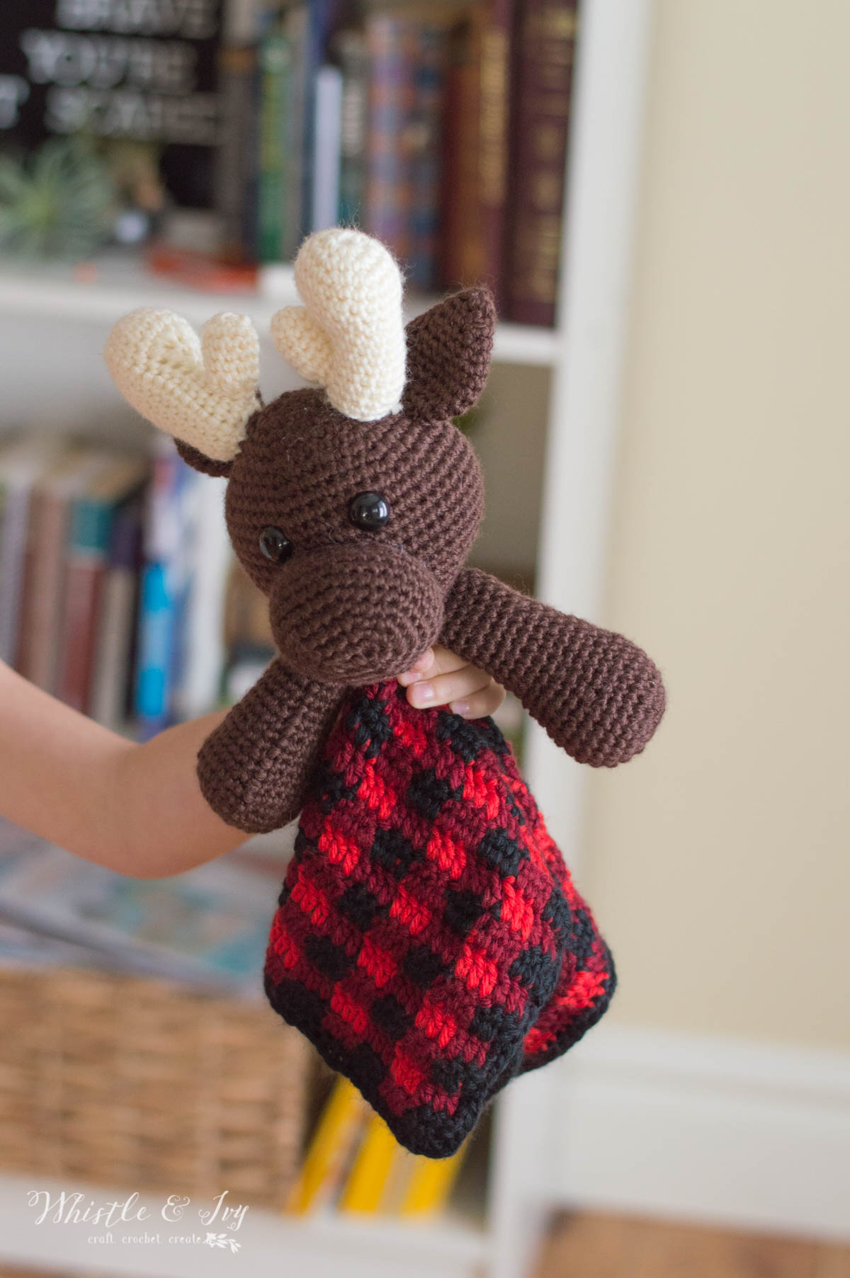 crochet pattern for cute moose lovey with buffalo plaid blanket