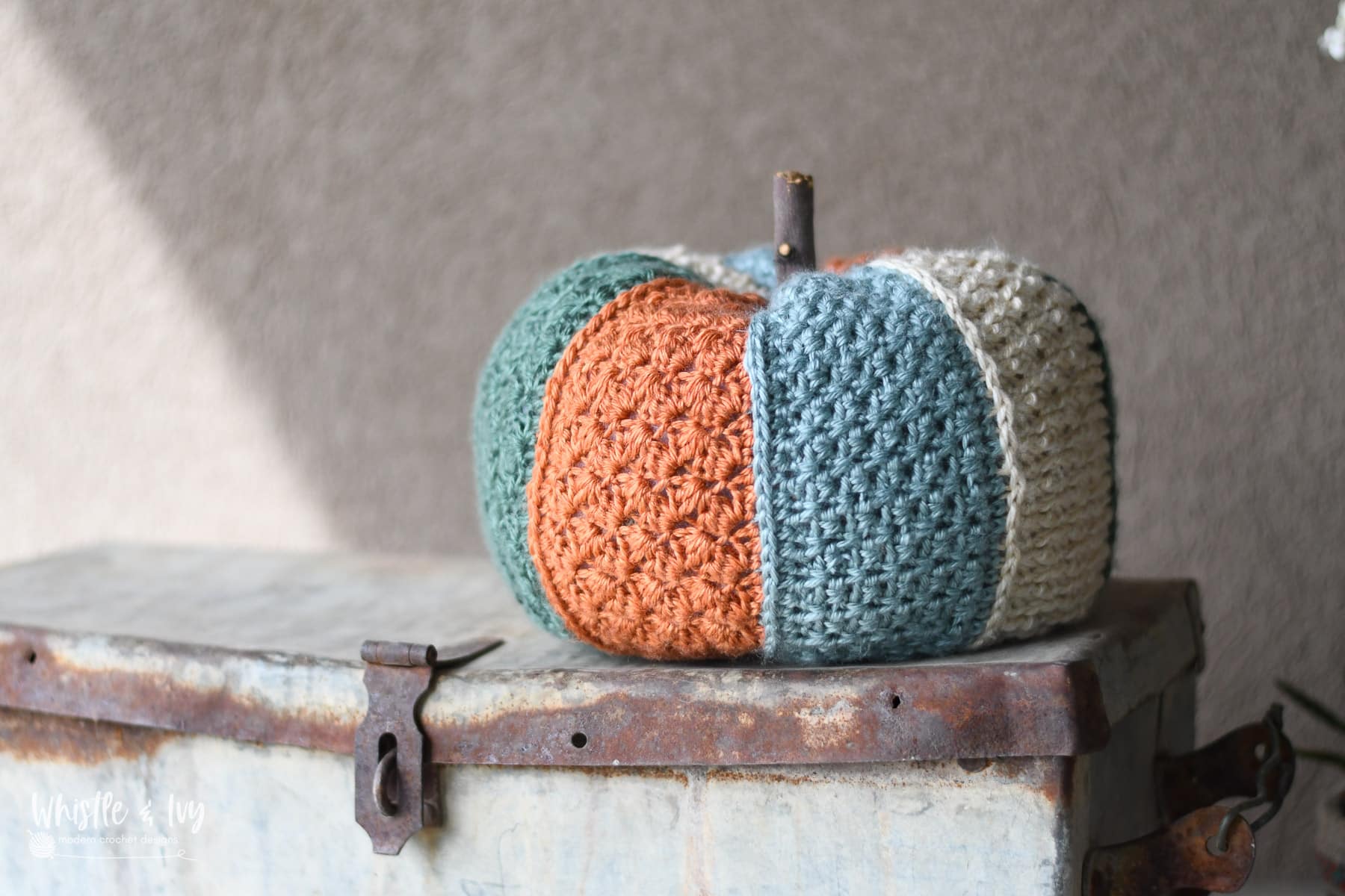 stitch sampler crochet pumpkin with colored panels featuring varying textured stitches, crochet pattern